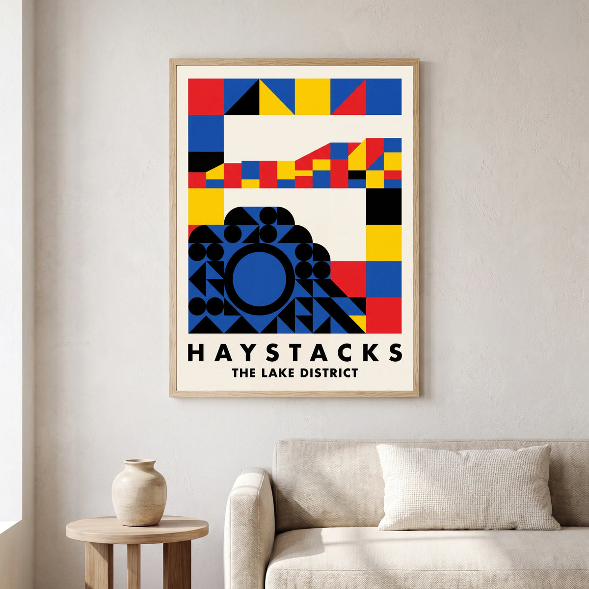 Haystacks travel poster in a natural frame, hanging in a living