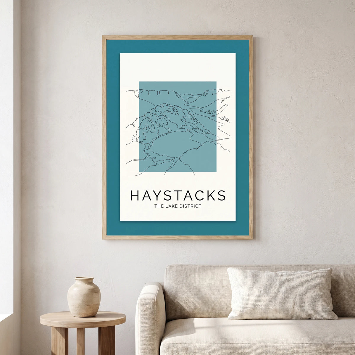 Haystacks travel poster in a natural frame, hanging in a living