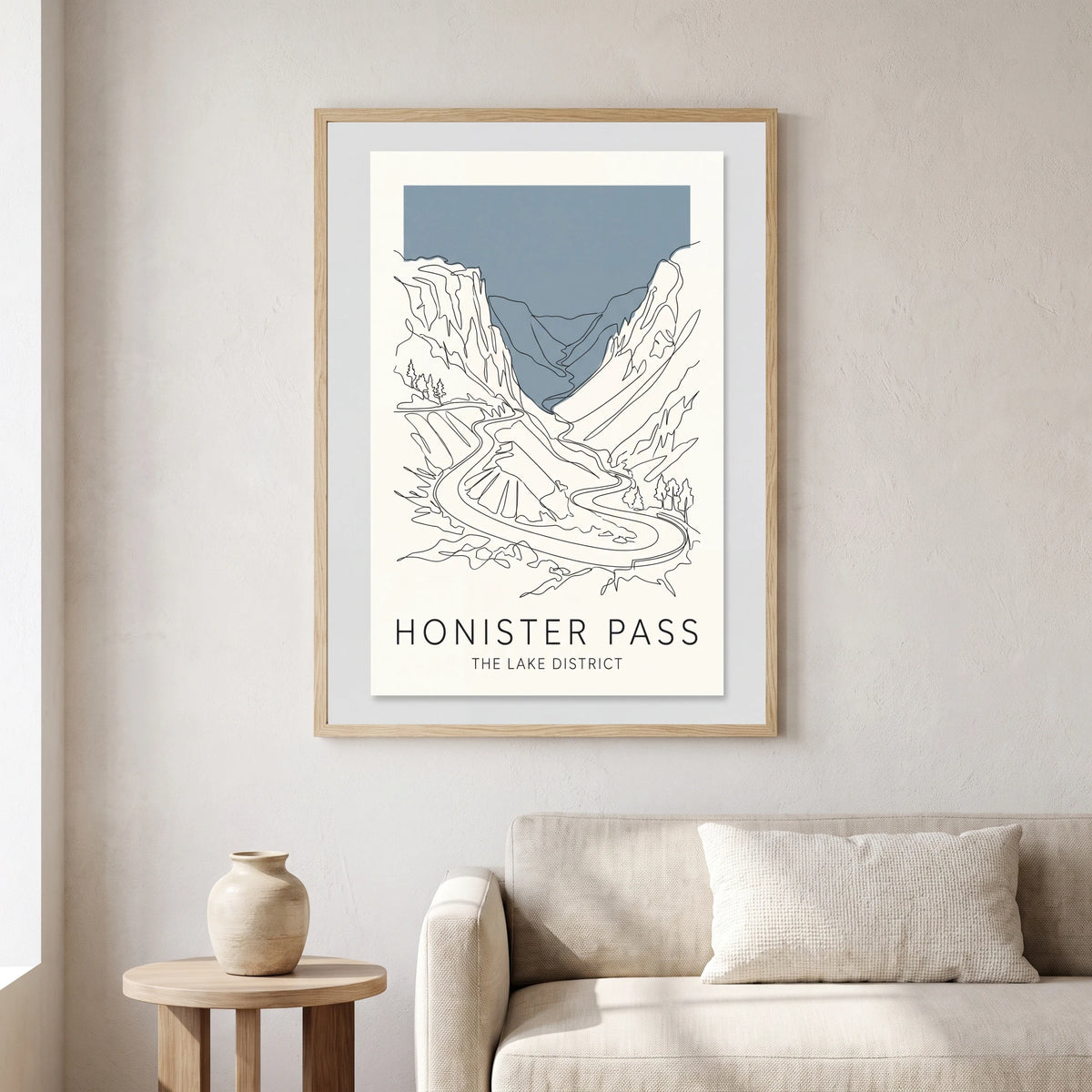 Honister Pass travel poster in a natural frame, hanging in a living