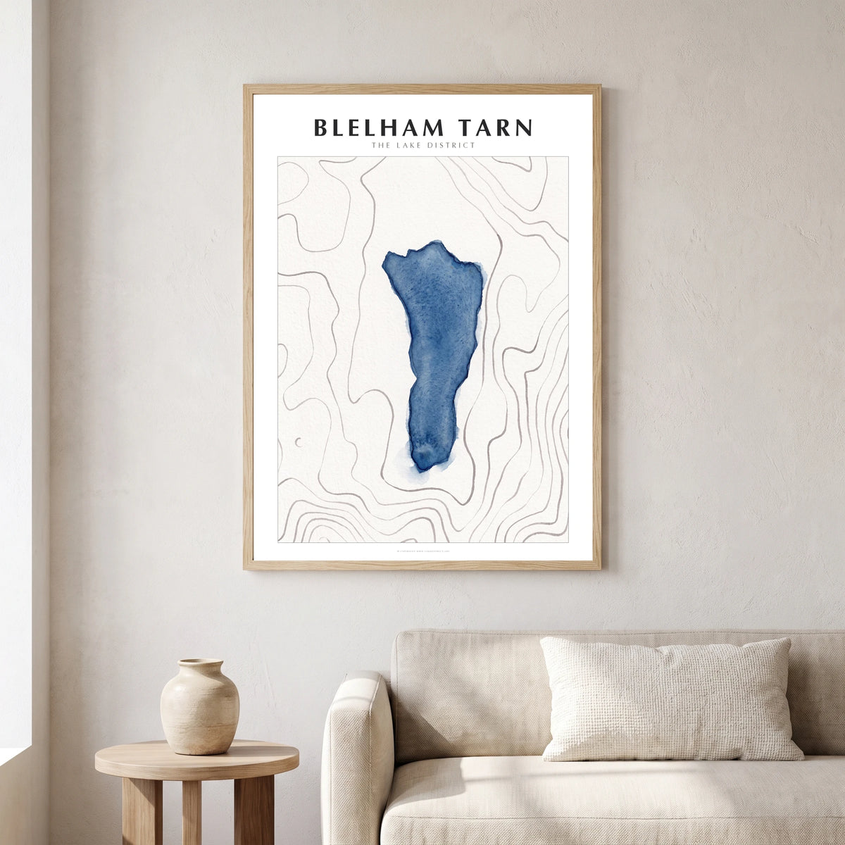 Blelham Tarn lake map poster in a natural frame, hanging in a living