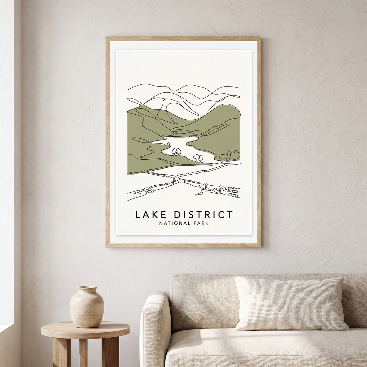 Lake District travel poster in a natural frame, hanging in a living