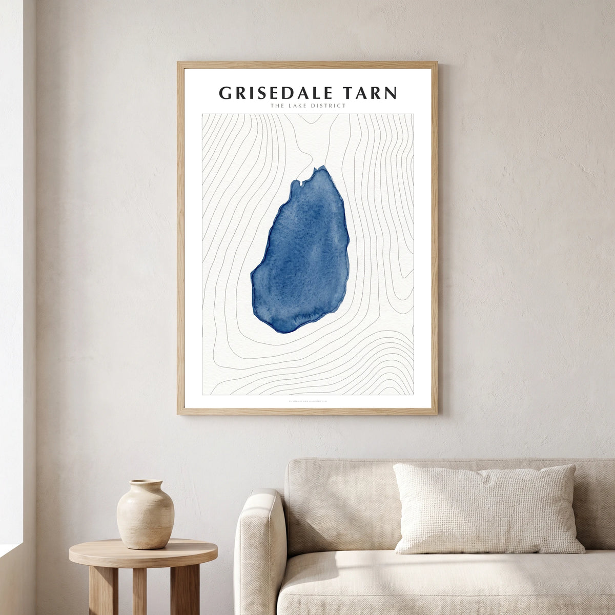 Grisedale Tarn lake map poster in a natural frame, hanging in a living