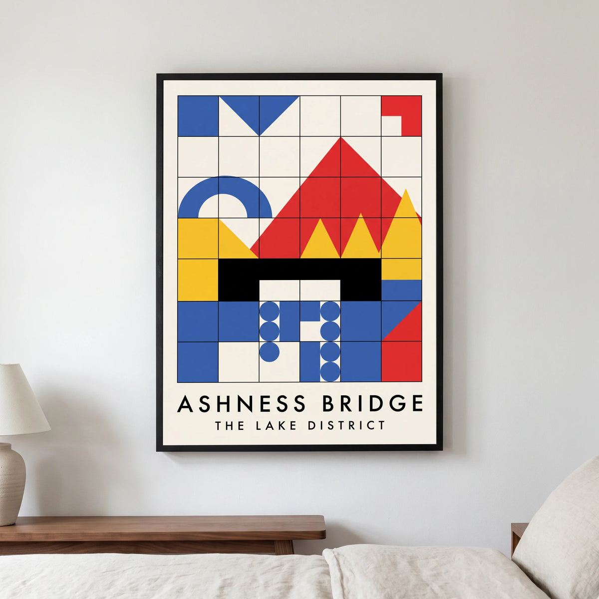 Ashness Bridge travel poster in a black frame, hanging in a bedroom3