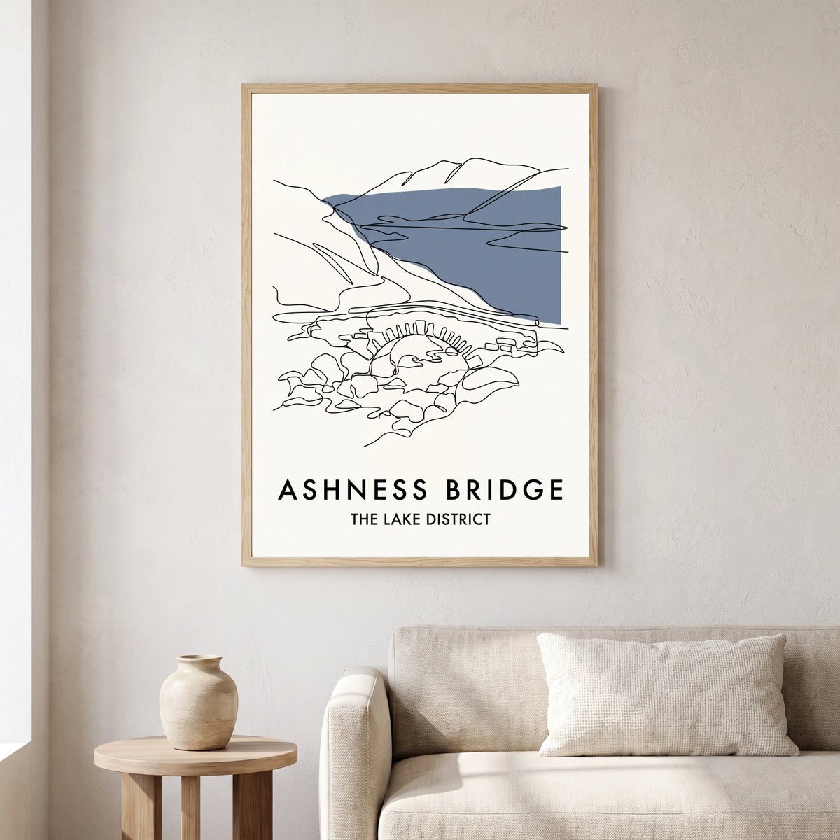 Ashness Bridge travel poster in a natural frame, hanging in a living