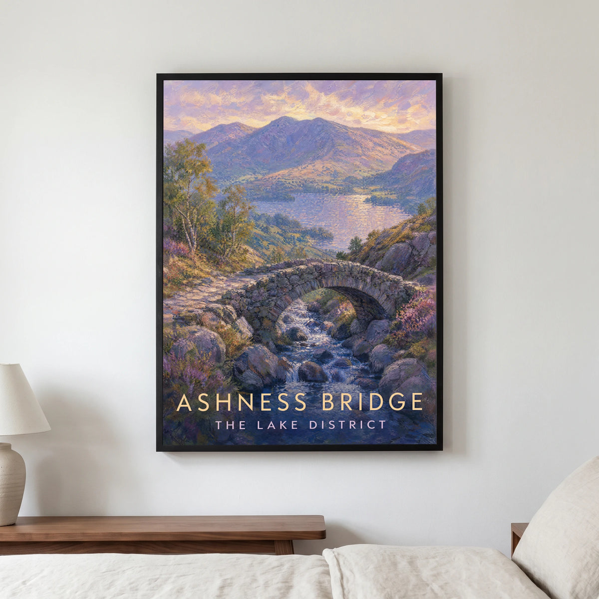 Ashness Bridge travel poster in a black frame, hanging in a bedroom3