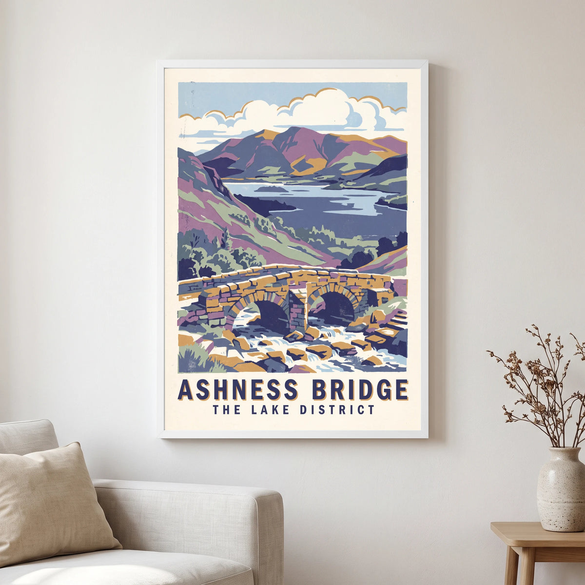 Ashness Bridge travel poster in a white frame, hanging in a living2