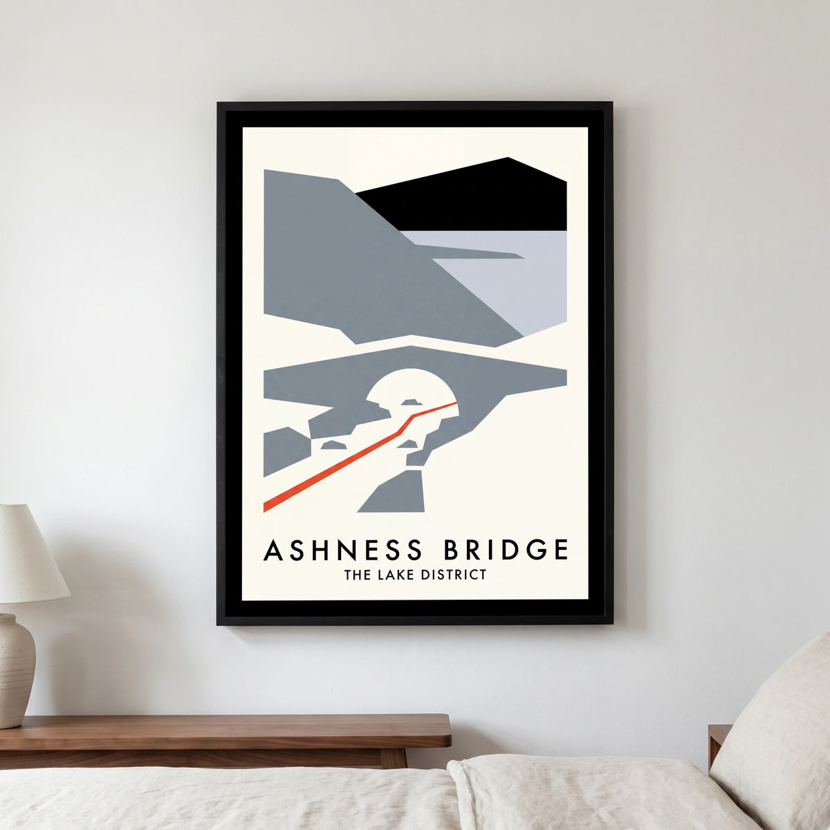 Ashness Bridge travel poster in a black frame, hanging in a bedroom3