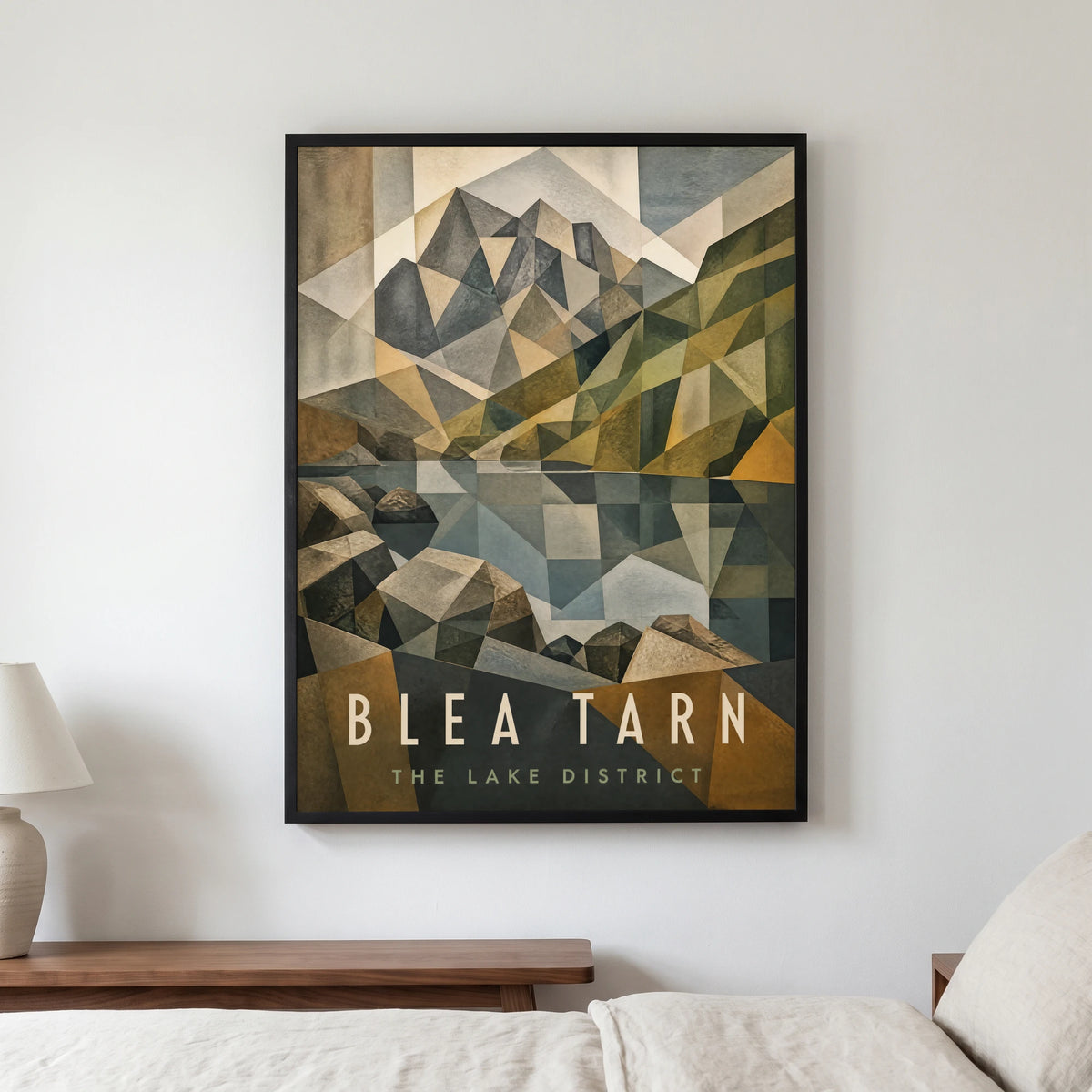 Blea Tarn travel poster in a black frame, hanging in a bedroom3