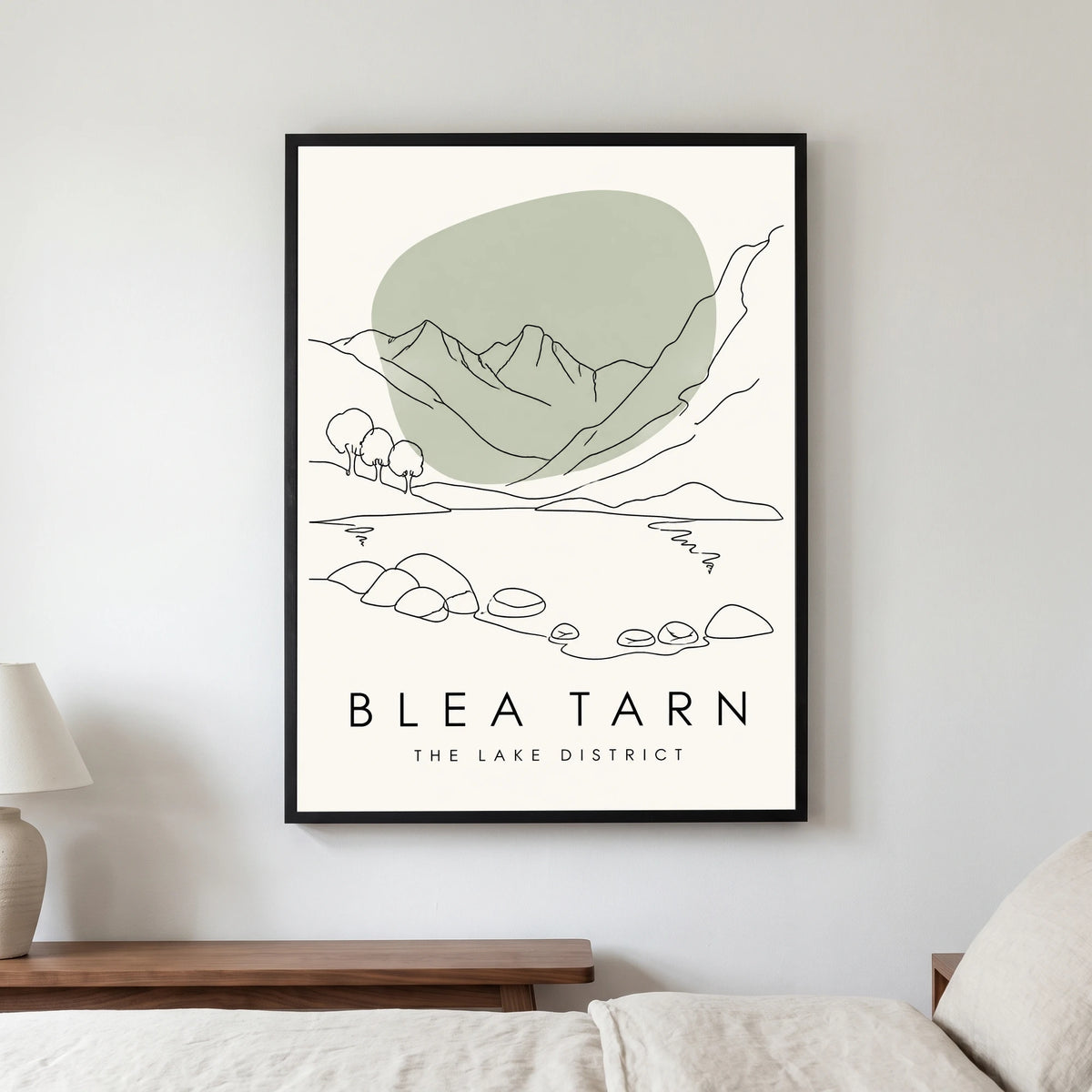 Blea Tarn travel poster in a black frame, hanging in a bedroom3