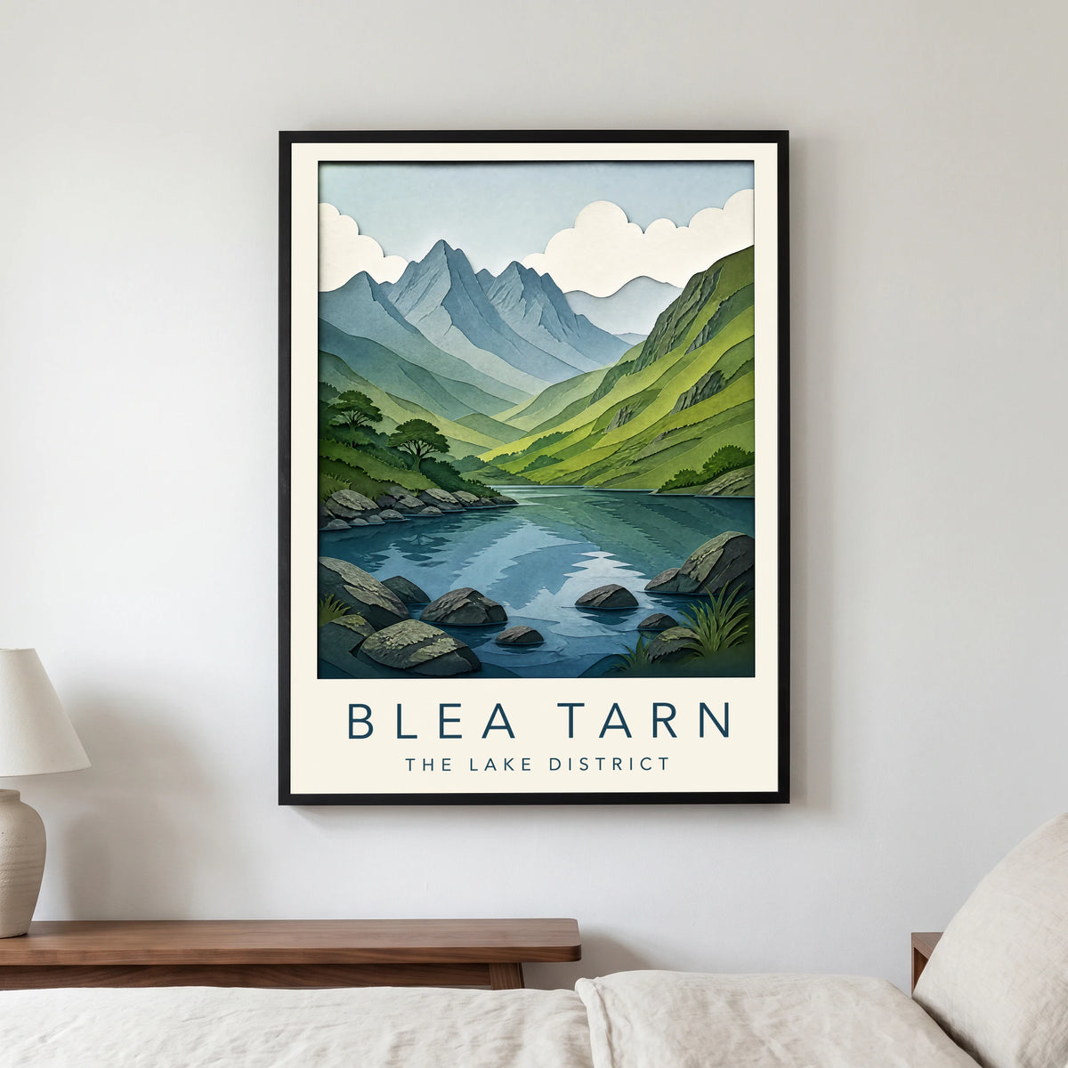 Blea Tarn travel poster in a black frame, hanging in a bedroom3