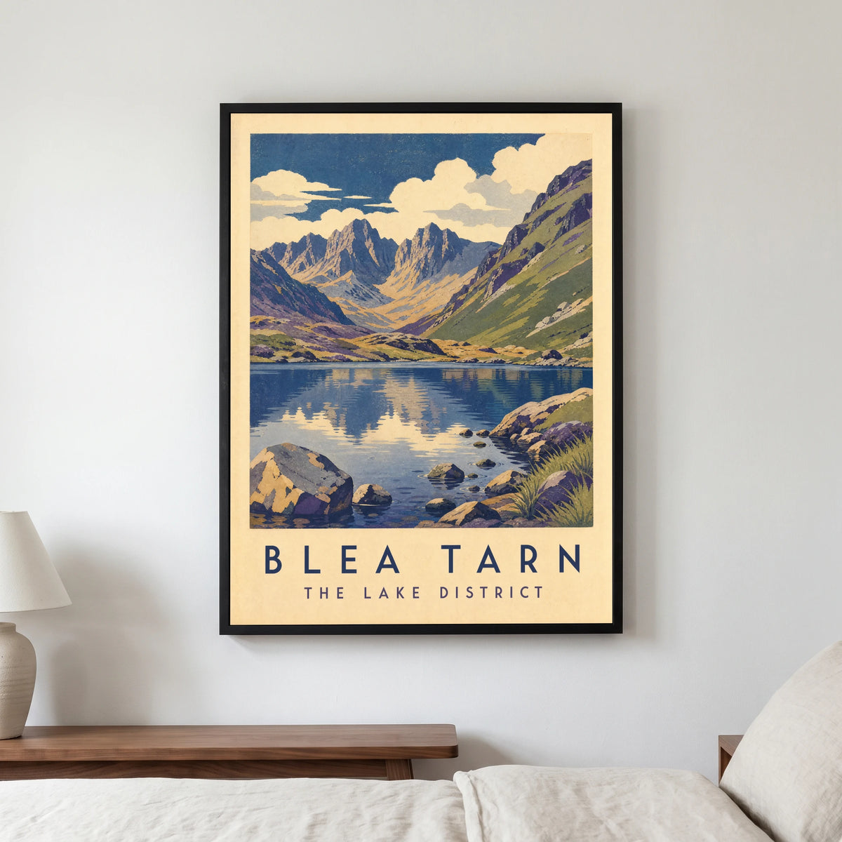 Blea Tarn travel poster in a black frame, hanging in a bedroom3