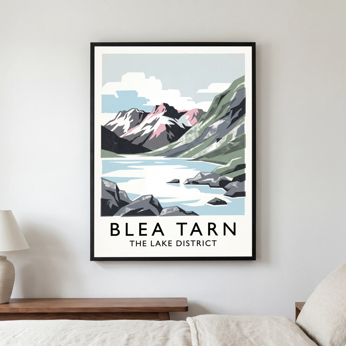 Blea Tarn travel poster in a black frame, hanging in a bedroom3