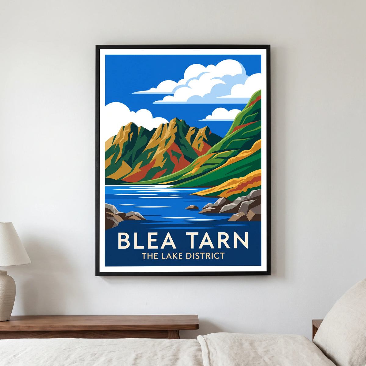 Blea Tarn travel poster in a black frame, hanging in a bedroom3