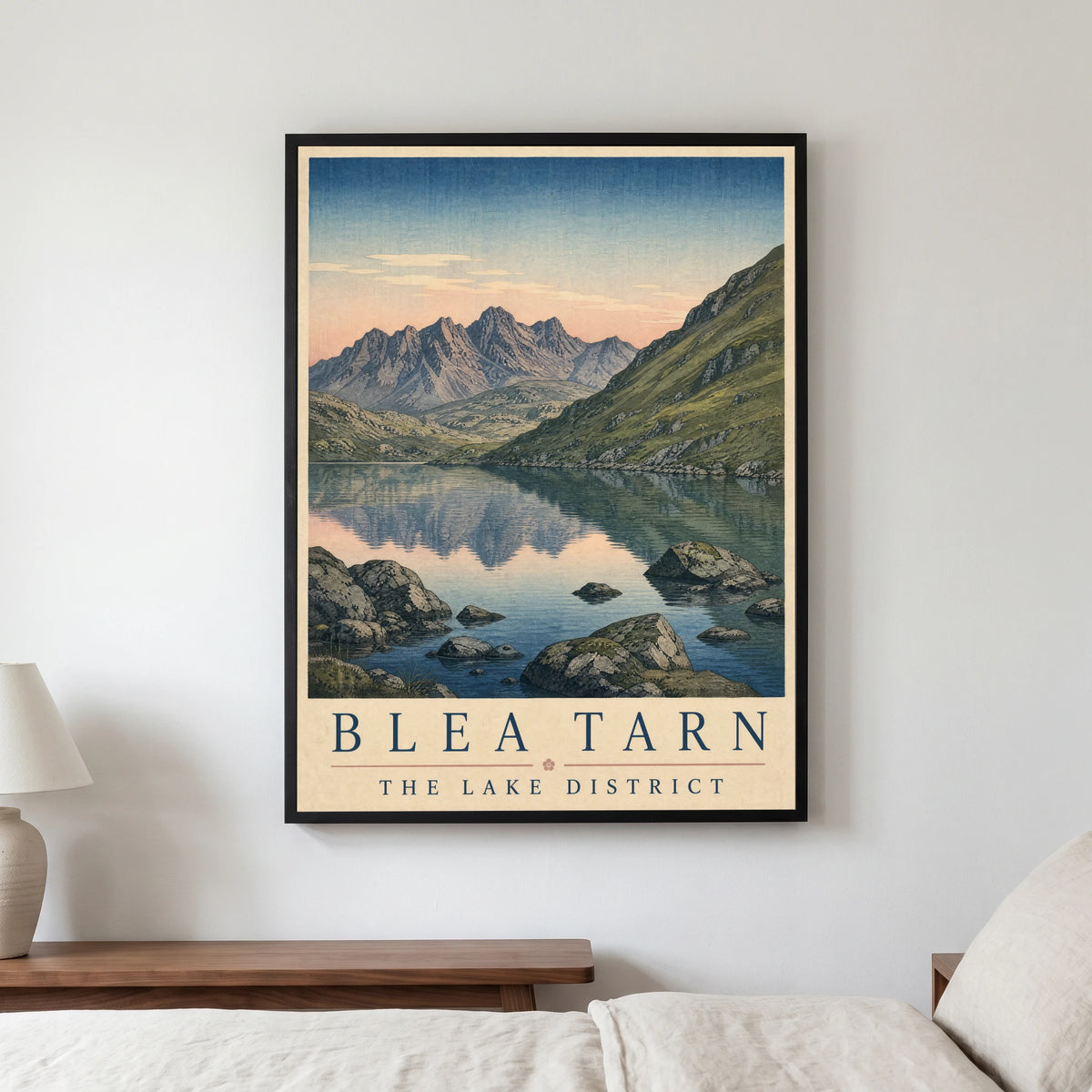 Blea Tarn travel poster in a black frame, hanging in a bedroom3