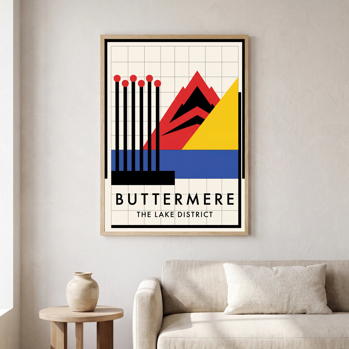 Buttermere travel poster in a natural frame, hanging in a living