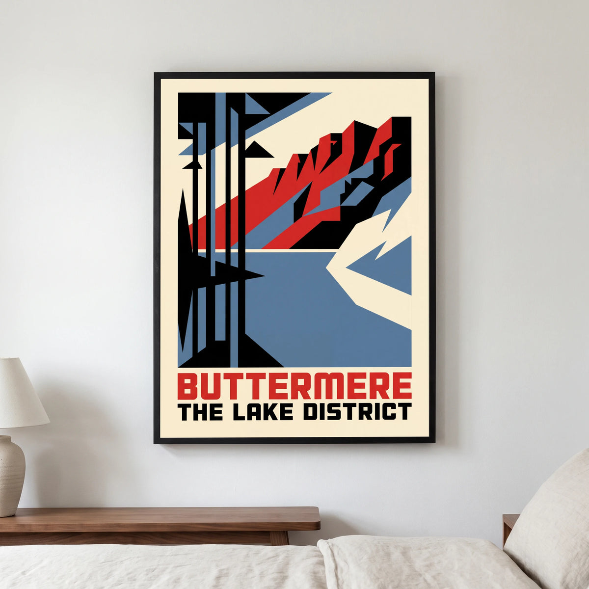 Buttermere travel poster in a black frame, hanging in a bedroom3