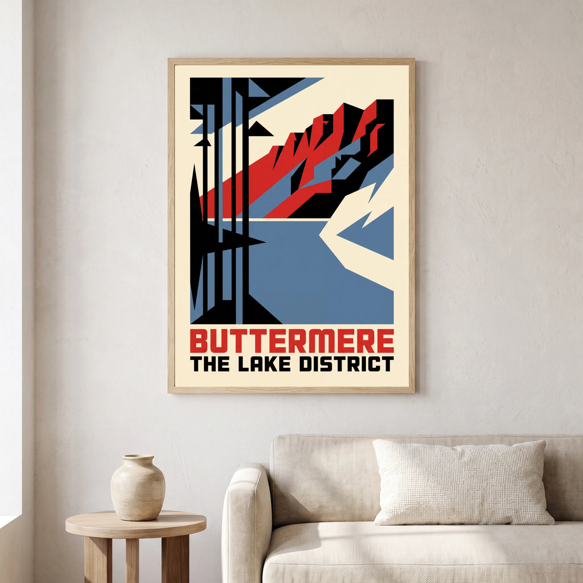 Buttermere travel poster in a natural frame, hanging in a living