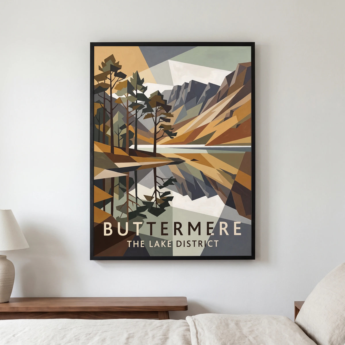 Buttermere travel poster in a black frame, hanging in a bedroom3