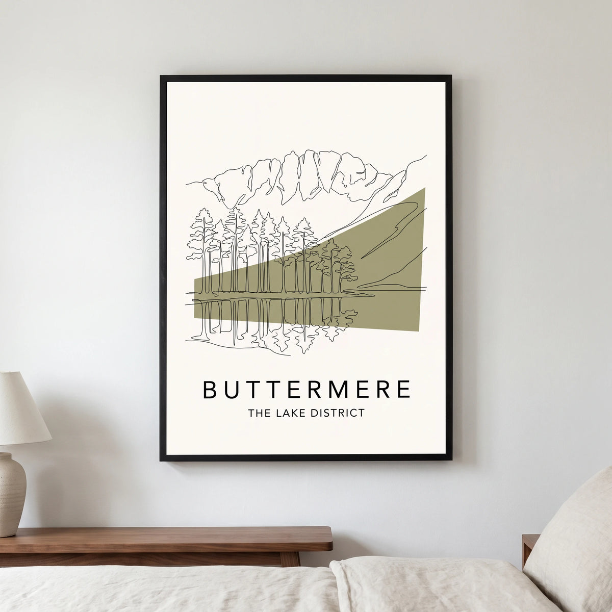 Buttermere travel poster in a black frame, hanging in a bedroom3