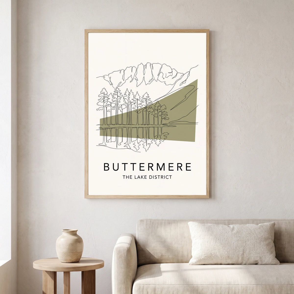 Buttermere travel poster in a natural frame, hanging in a living