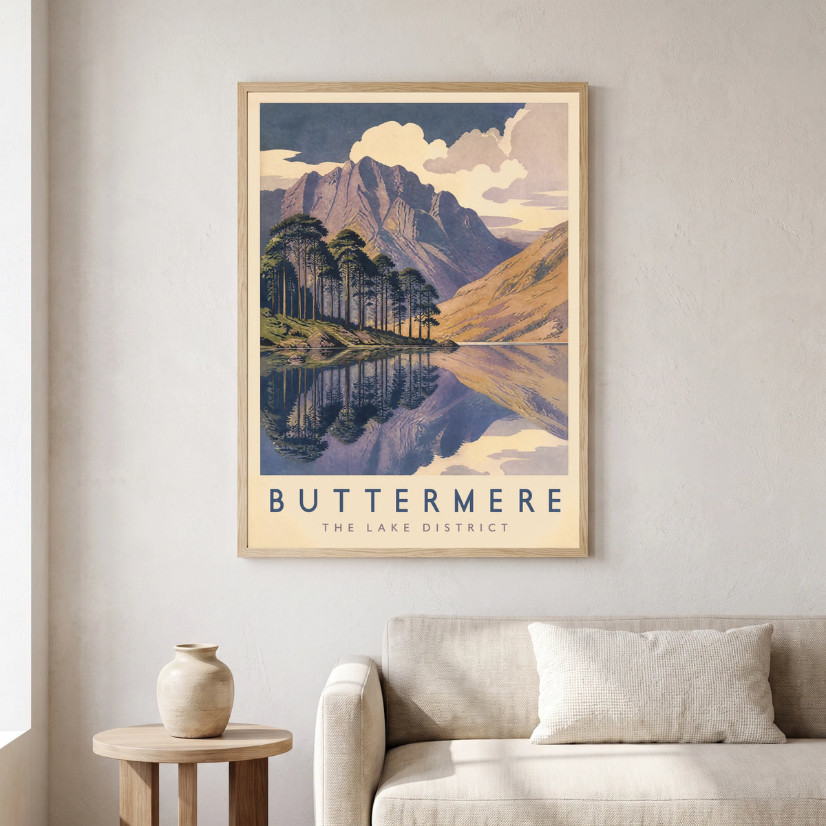Buttermere travel poster in a natural frame, hanging in a living
