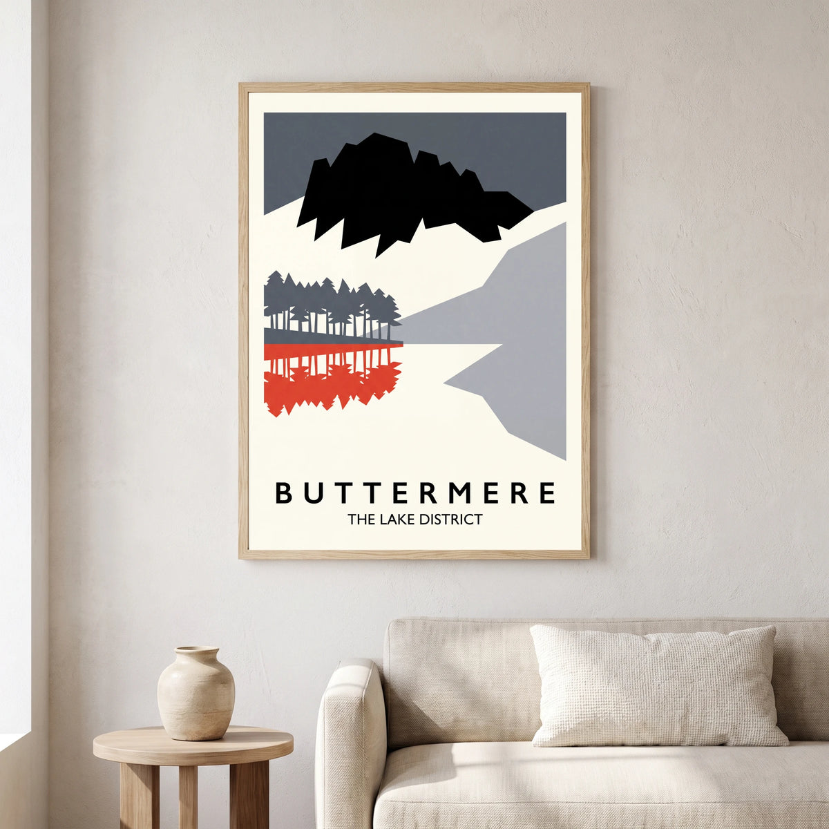 Buttermere travel poster in a natural frame, hanging in a living
