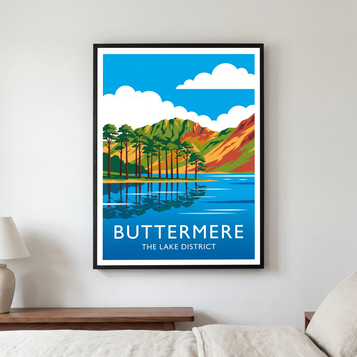 Buttermere travel poster in a black frame, hanging in a bedroom3