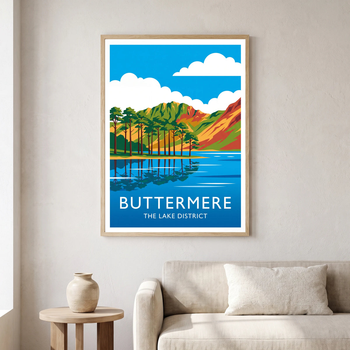Buttermere travel poster in a natural frame, hanging in a living