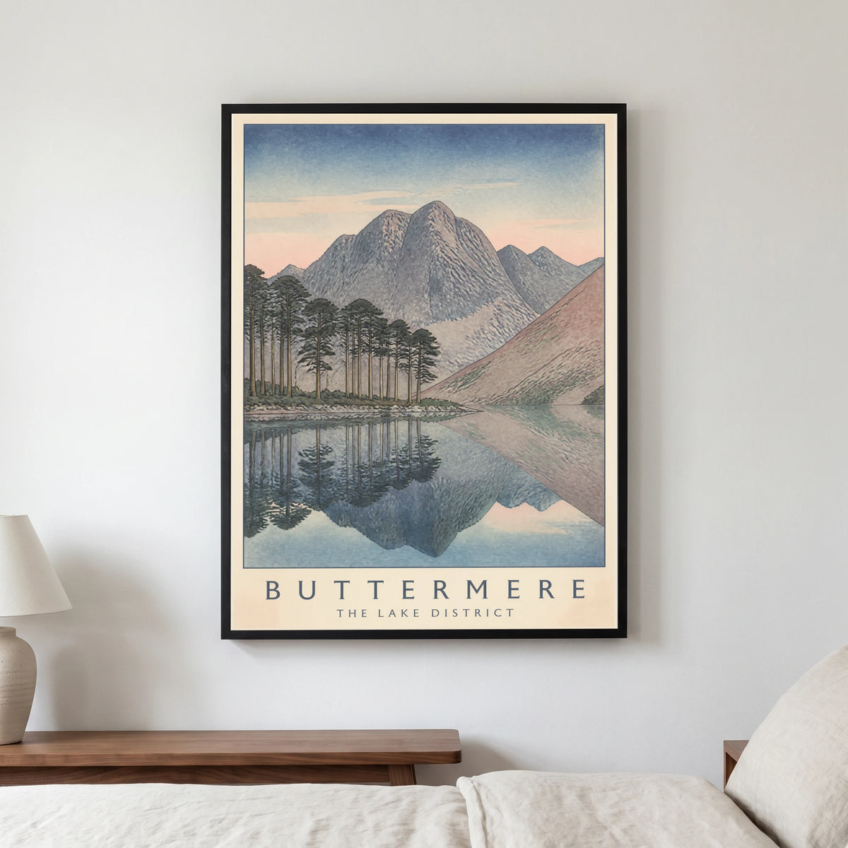 Buttermere travel poster in a black frame, hanging in a bedroom3