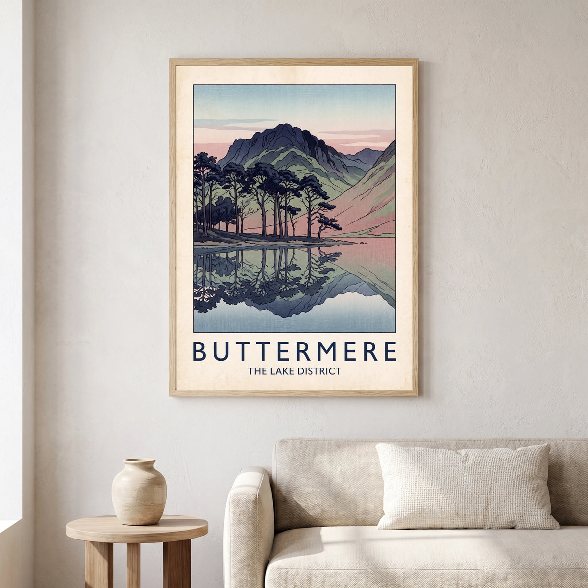 Buttermere travel poster in a natural frame, hanging in a living