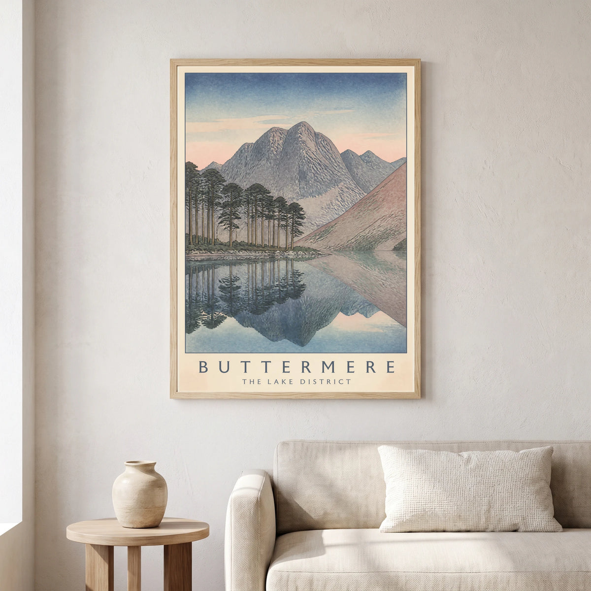 Buttermere travel poster in a natural frame, hanging in a living