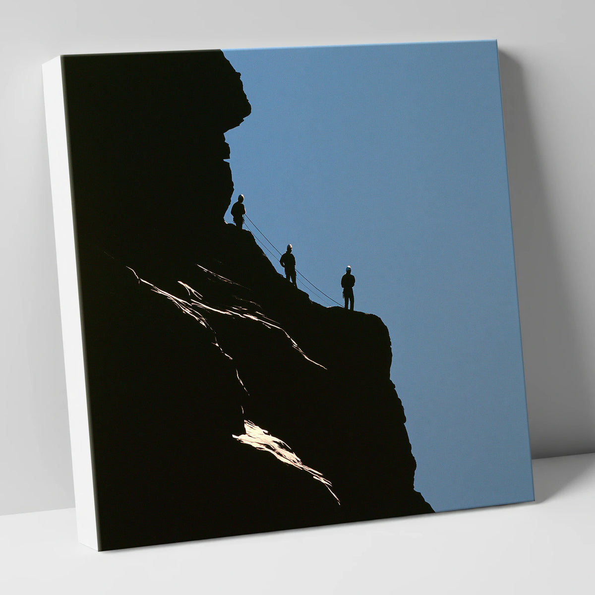 Silhouetted Climbers on a Crag lake district walking canvas wall art