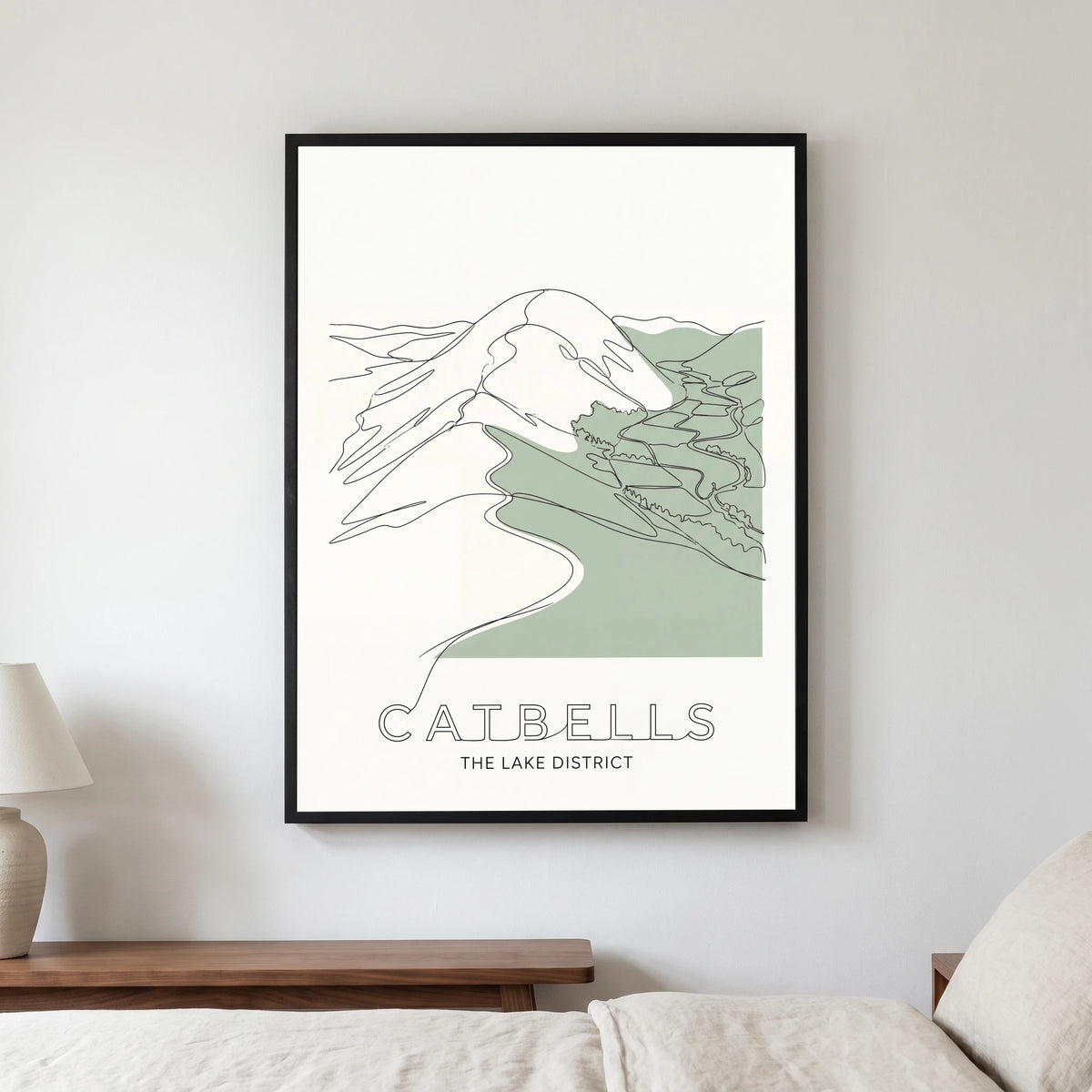 Catbells travel poster in a black frame, hanging in a bedroom3