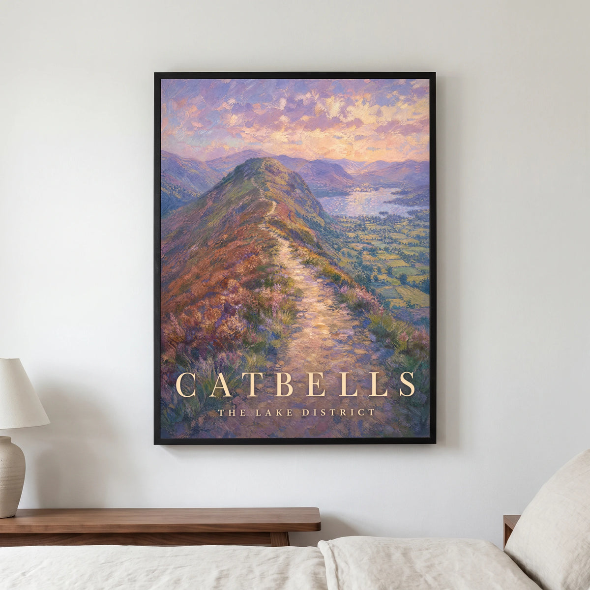 Catbells travel poster in a black frame, hanging in a bedroom3