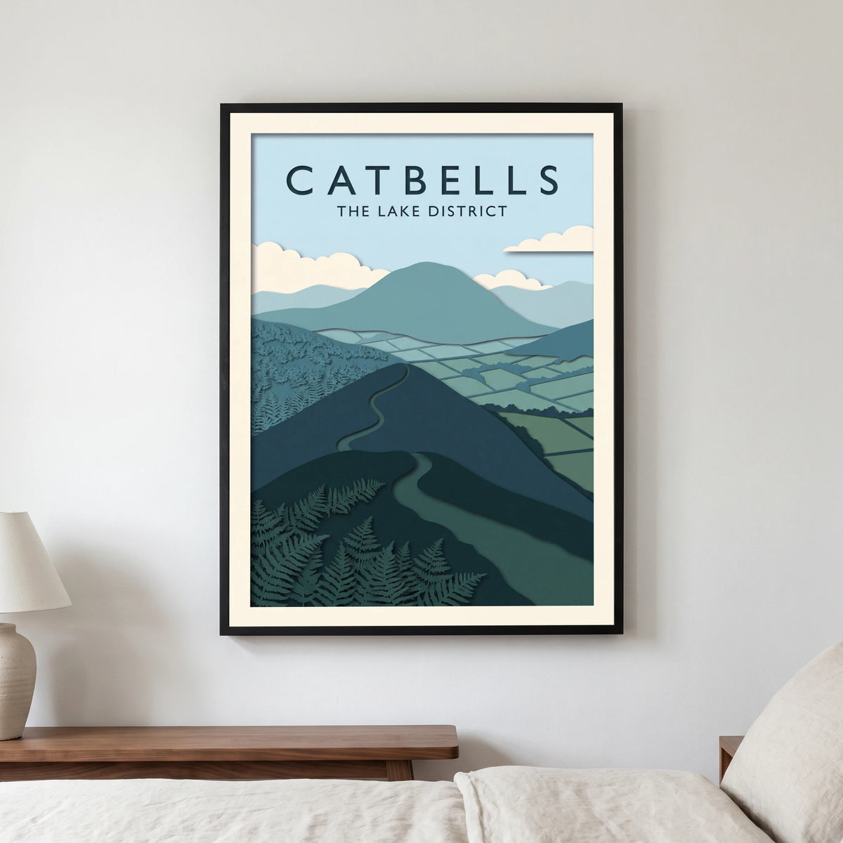 Catbells travel poster in a black frame, hanging in a bedroom3