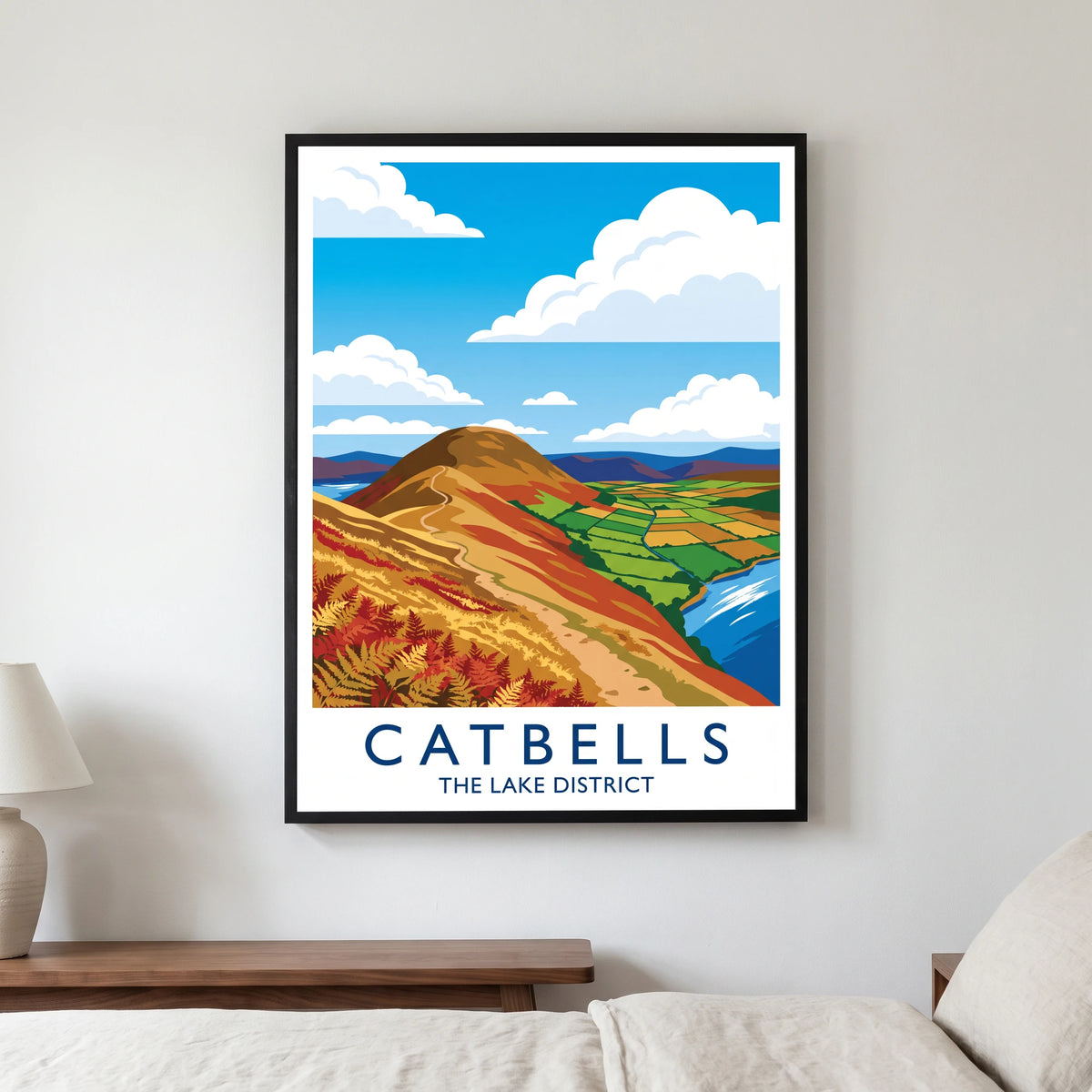 Catbells travel poster in a black frame, hanging in a bedroom3