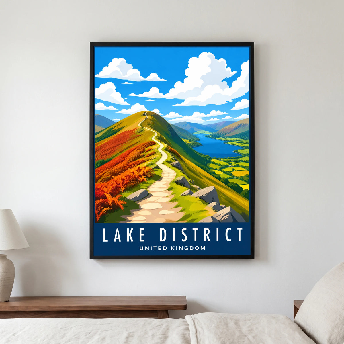 Catbells travel poster in a black frame, hanging in a bedroom3