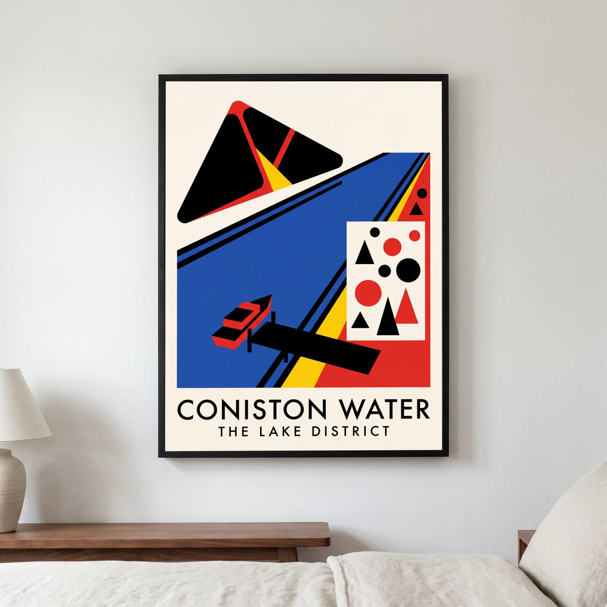 Coniston Water travel poster in a black frame, hanging in a bedroom3