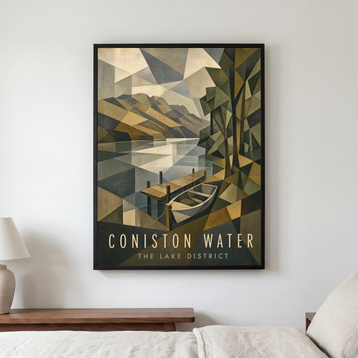 Coniston Water travel poster in a black frame, hanging in a bedroom3