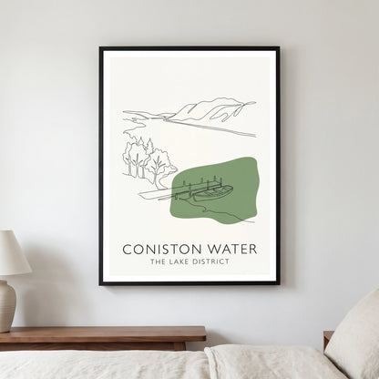 Coniston Water travel poster in a black frame, hanging in a bedroom3