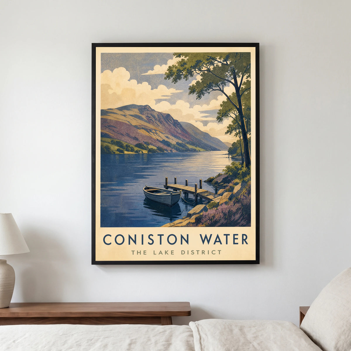 Coniston Water travel poster in a black frame, hanging in a bedroom3