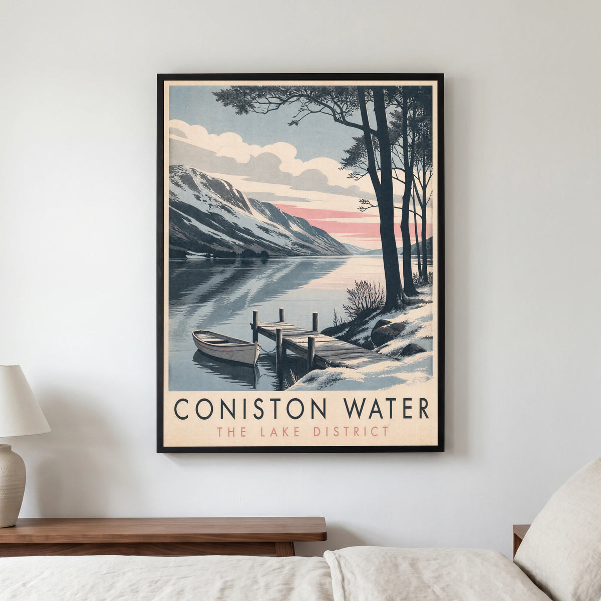 Coniston Water travel poster in a black frame, hanging in a bedroom3
