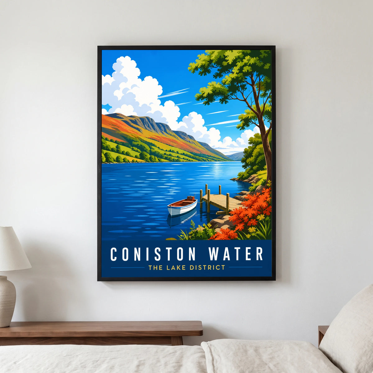 Coniston Water travel poster in a black frame, hanging in a bedroom3