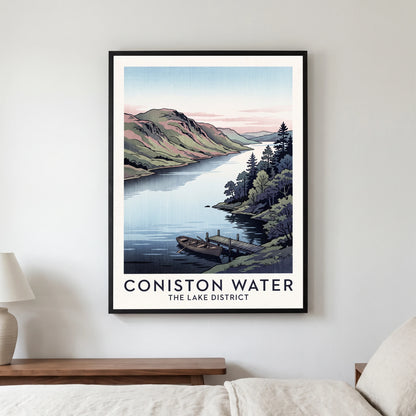 Coniston Water travel poster in a black frame, hanging in a bedroom3