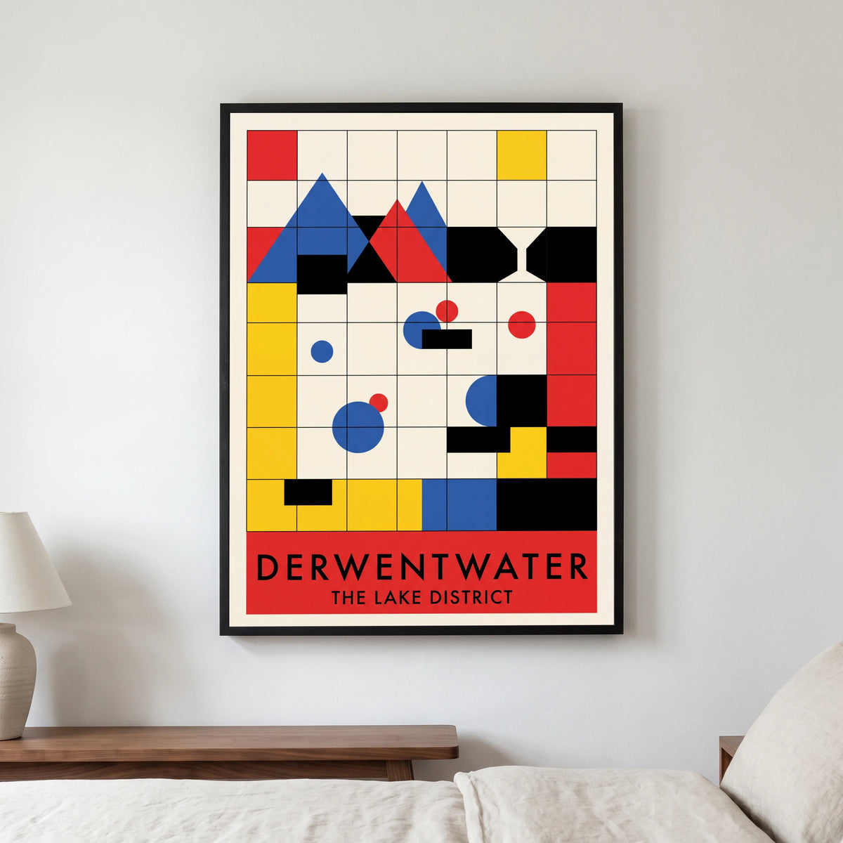Derwentwater travel poster in a black frame, hanging in a bedroom3