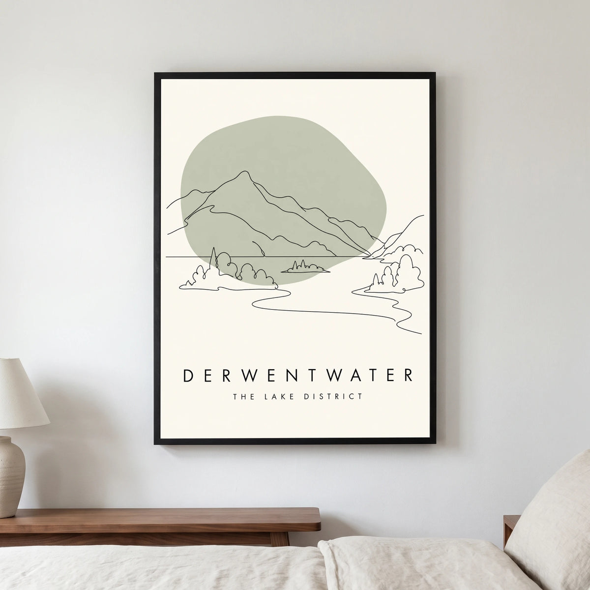 Derwentwater travel poster in a black frame, hanging in a bedroom3