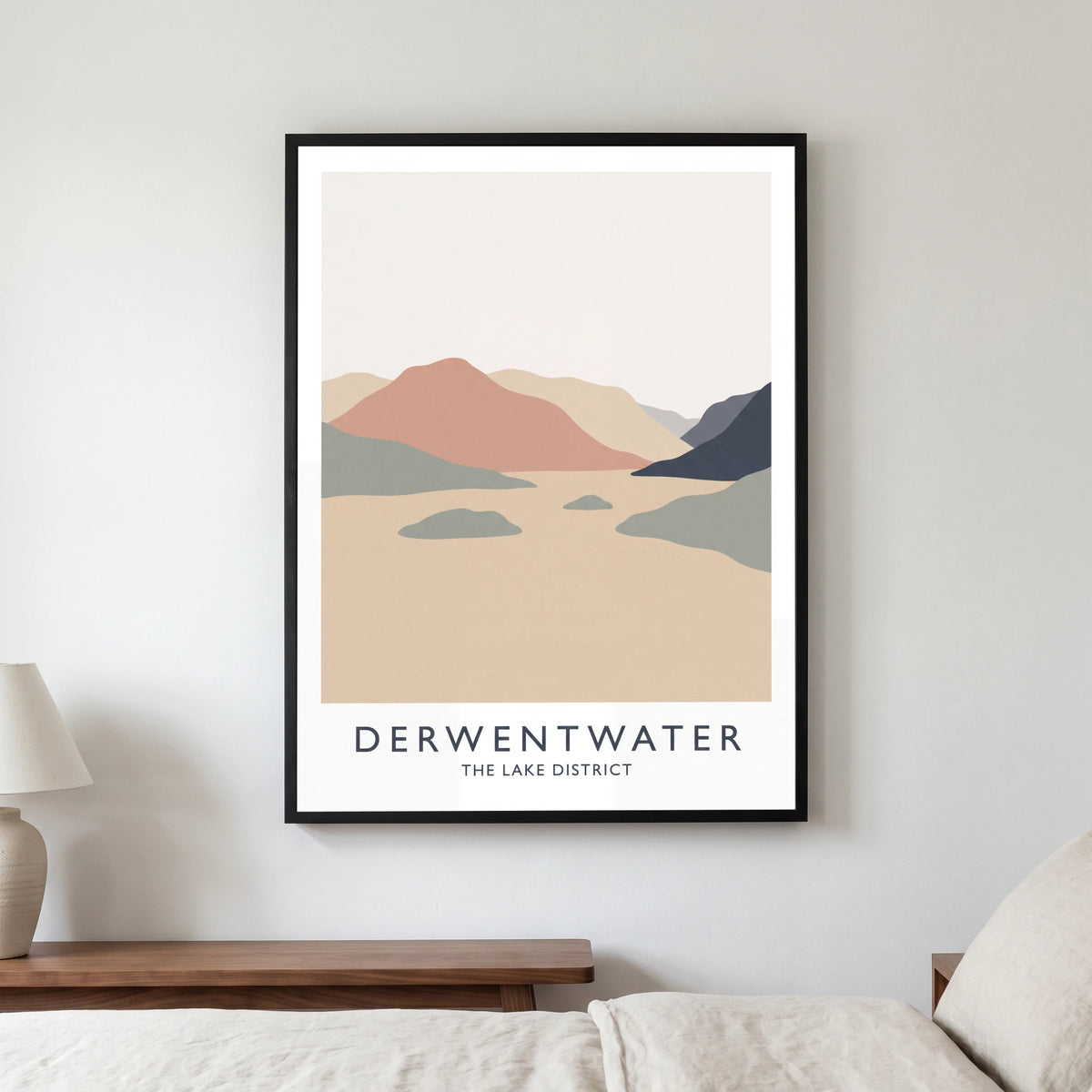 Derwentwater travel poster in a black frame, hanging in a bedroom3