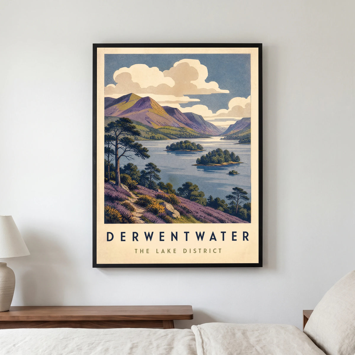 Derwentwater travel poster in a black frame, hanging in a bedroom3