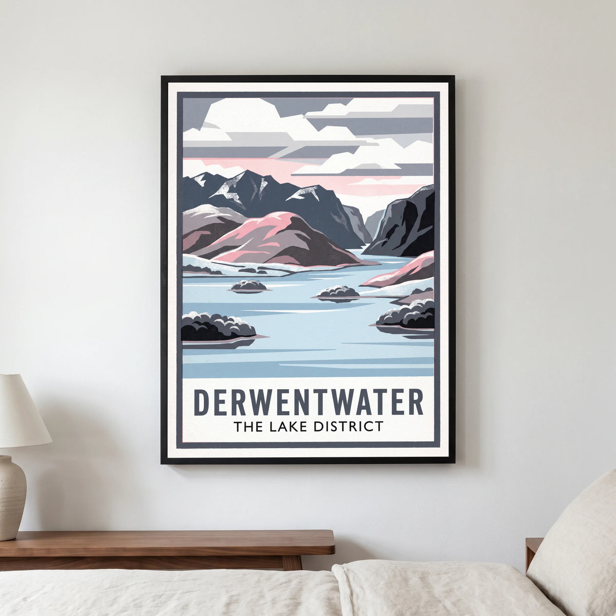 Derwentwater travel poster in a black frame, hanging in a bedroom3
