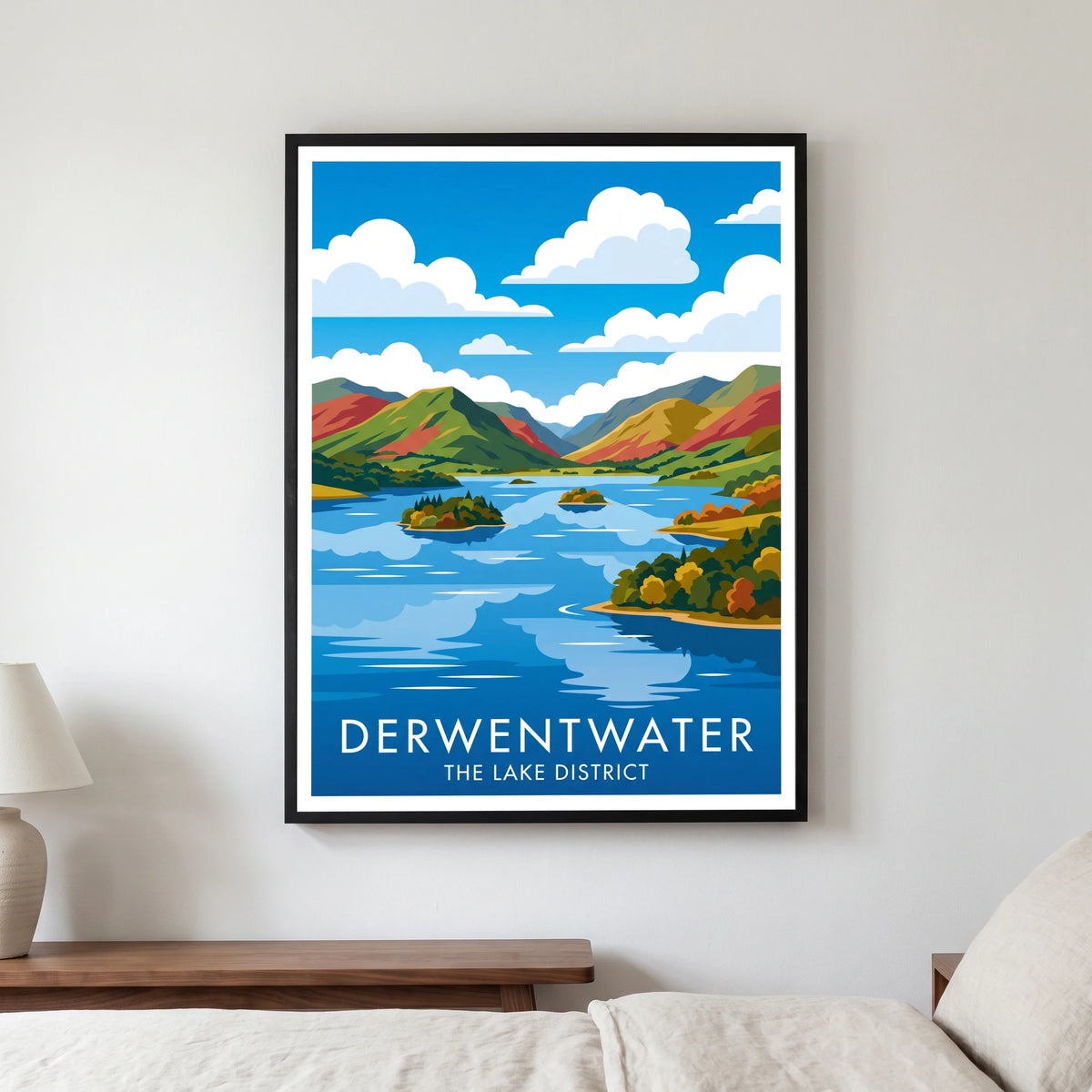 Derwentwater travel poster in a black frame, hanging in a bedroom3
